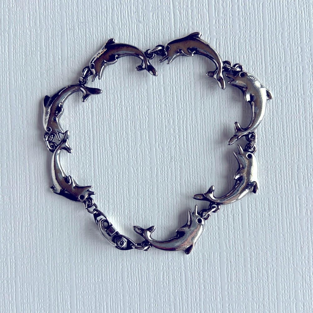 Silver Dolphins Charm Bracelet Size 7 1/4 inches in length. See pictures.